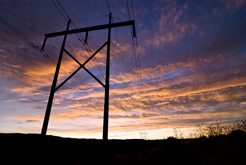Power lines against a sunset